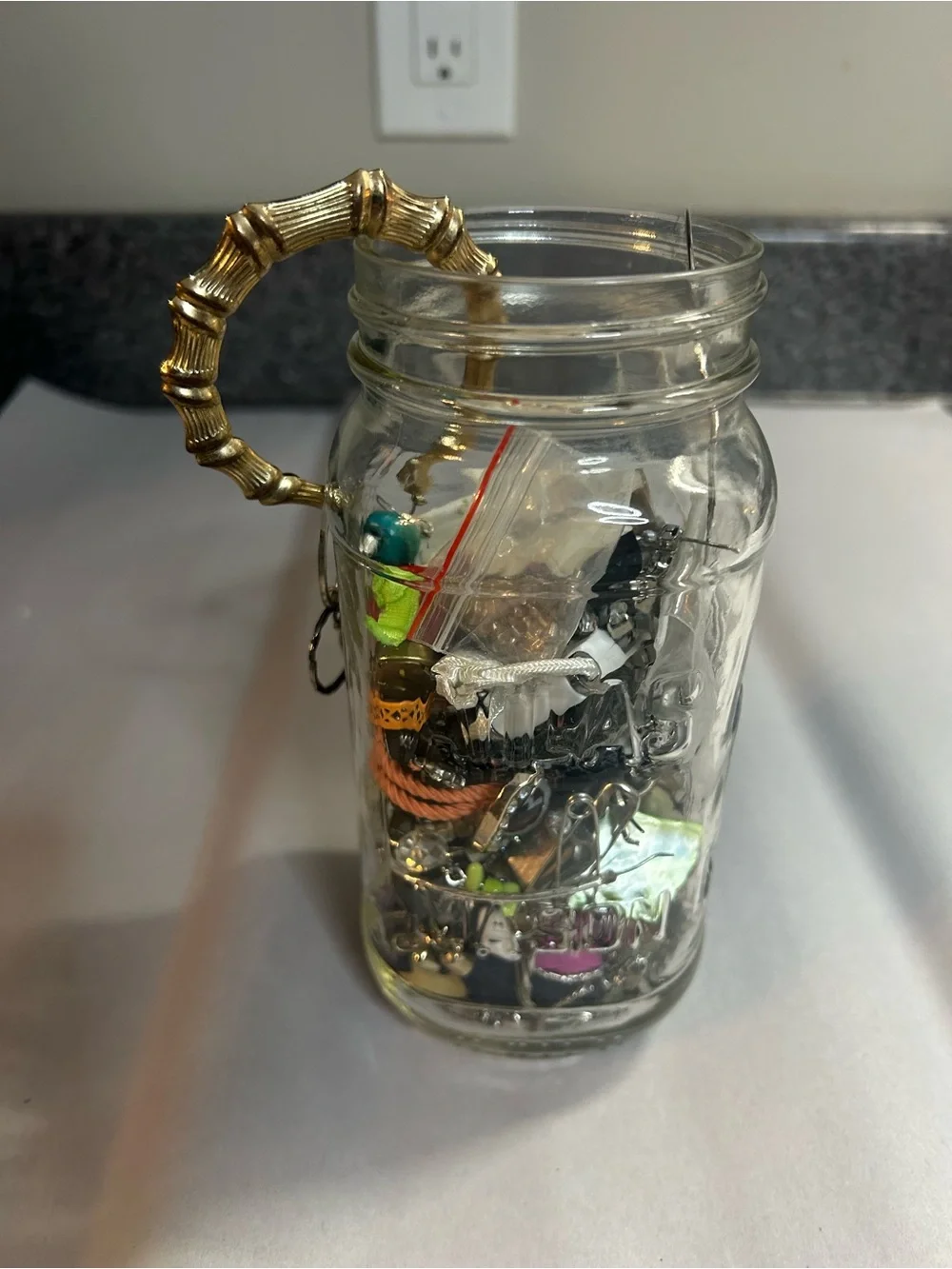 Jar full of crafting jewelry. Vintage to modern.